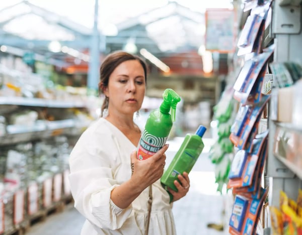 woman examines products copy